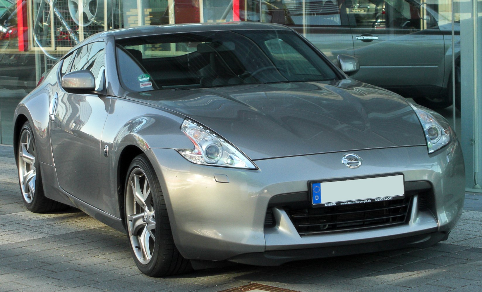 Front view with sleek headlights and alloy wheels