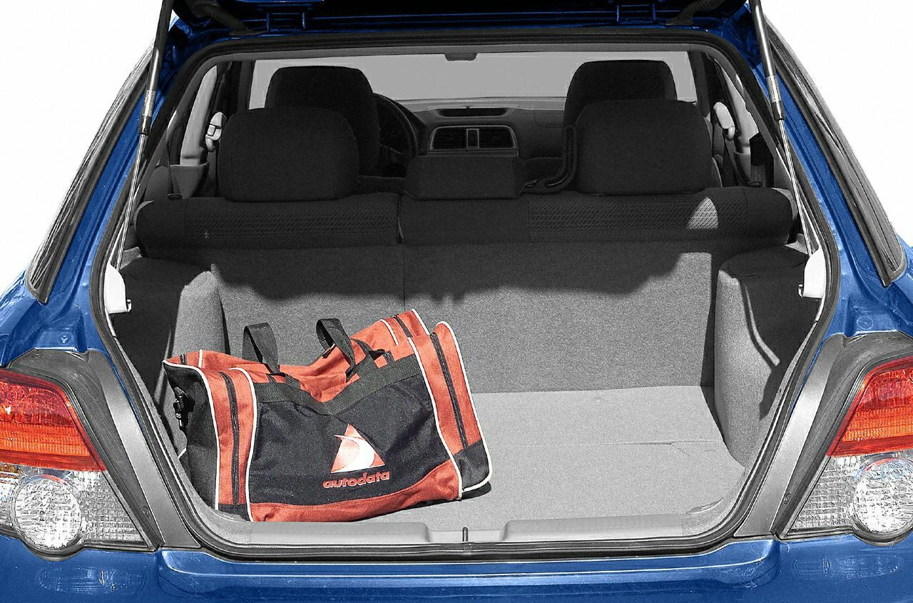 Rear trunk interior with foldable seats and cargo bag in a station wagon