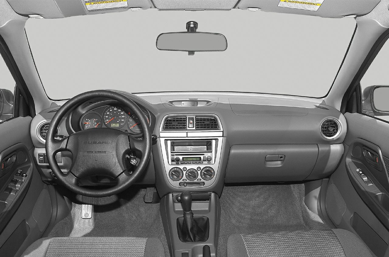 Dashboard, steering wheel, and manual gear shift interior view