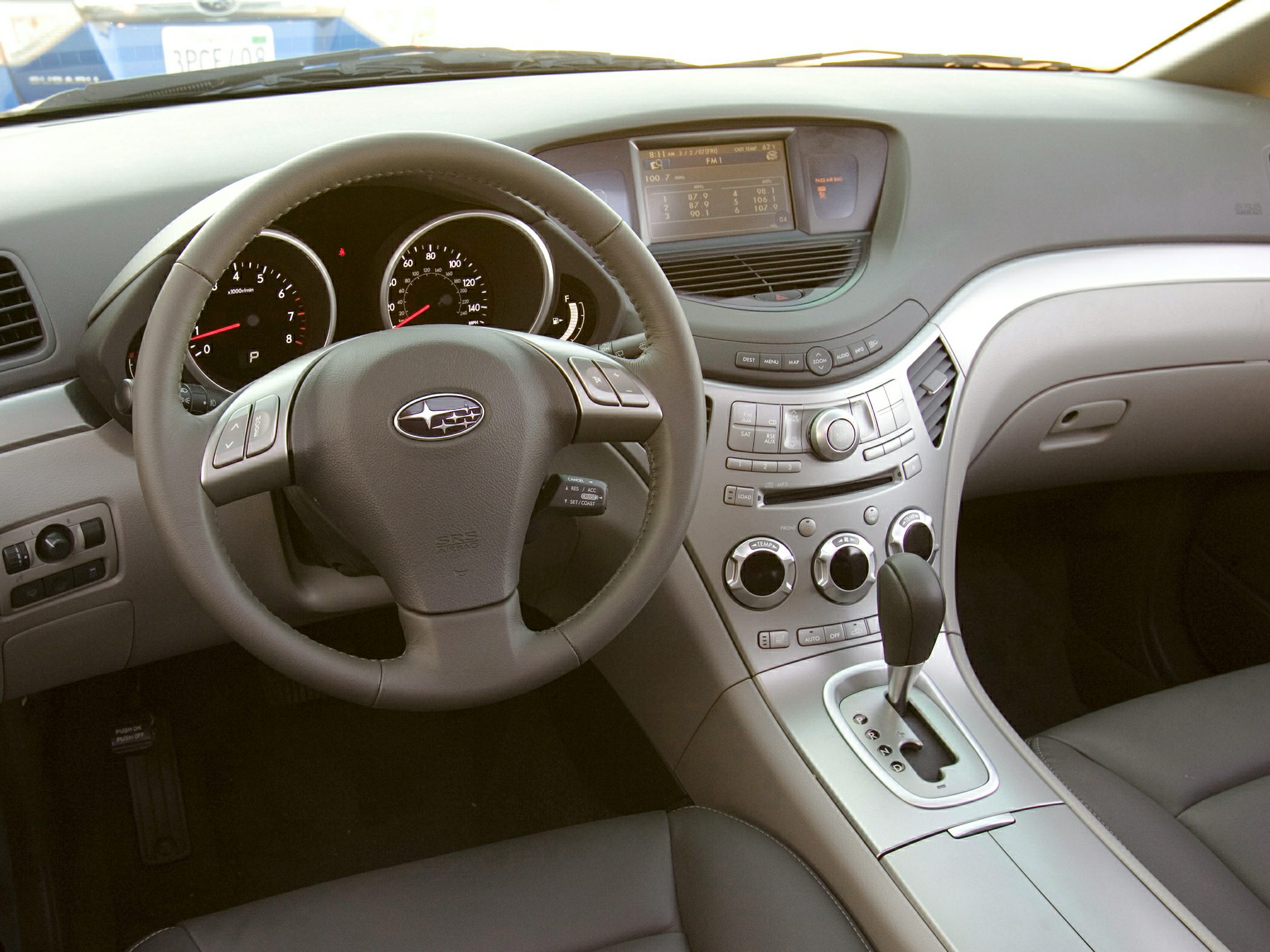 Dashboard and steering wheel with infotainment and climate controls