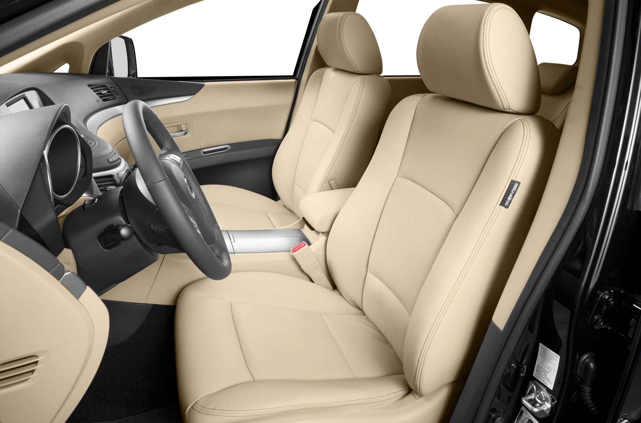 Beige leather front seats with steering wheel inside a vehicle