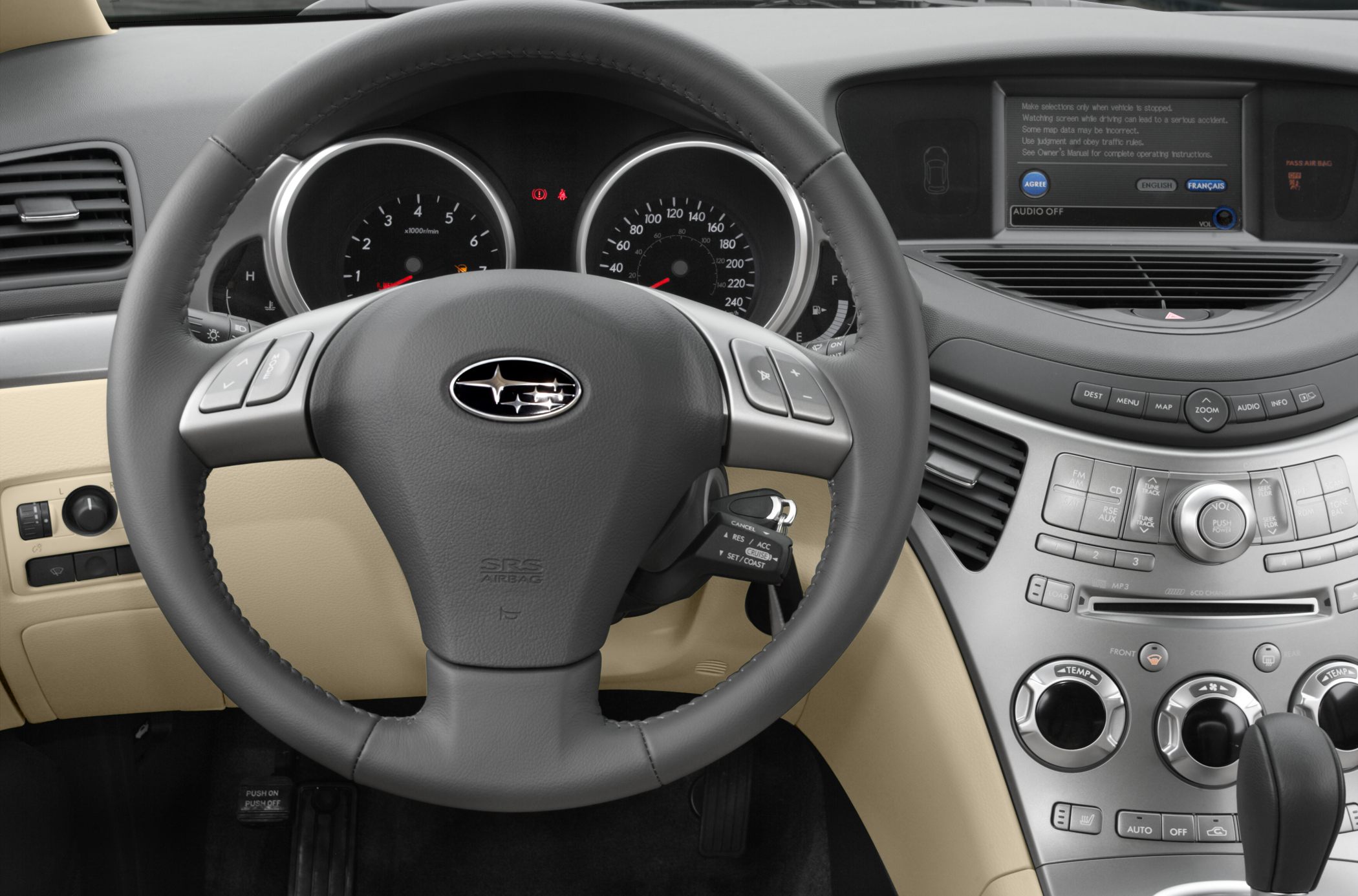 Dashboard and steering wheel with instrument cluster and infotainment screen