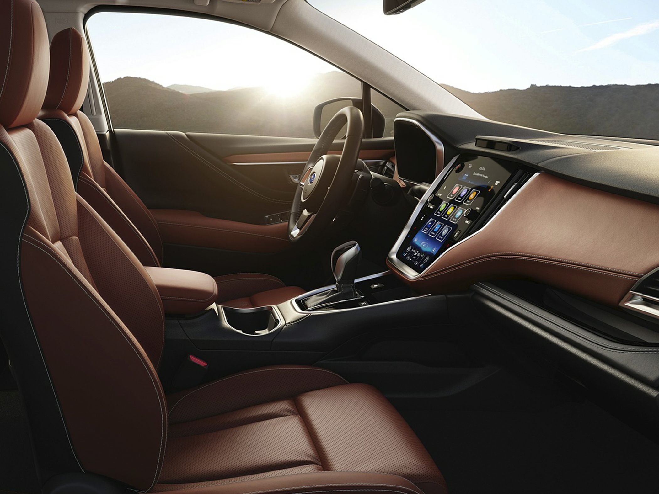 Brown leather seats and vertical touchscreen infotainment system