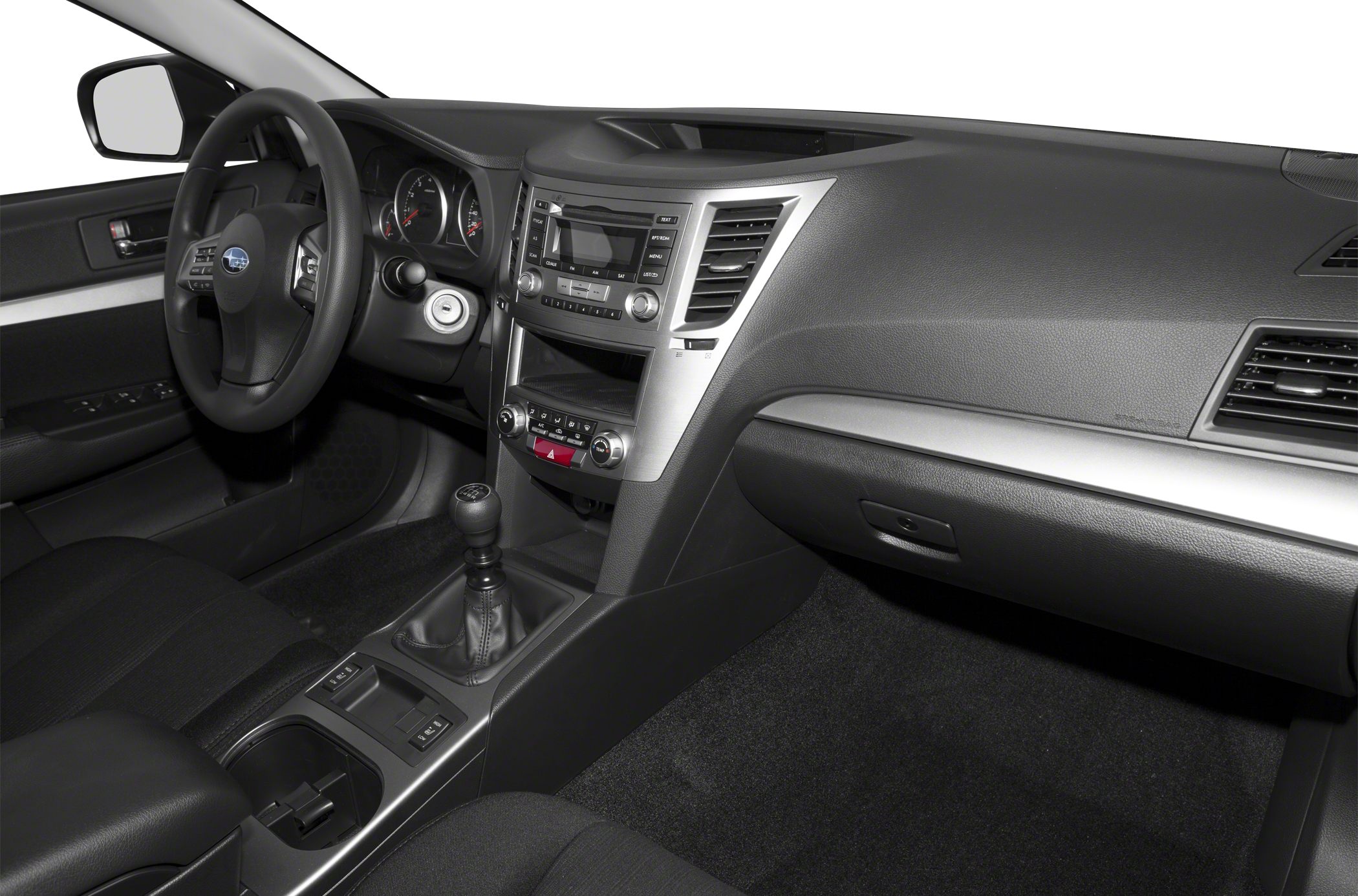 Black interior with dashboard, steering wheel, and manual gear shift