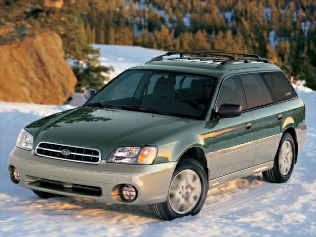Station wagon in winter landscape with roof racks and rugged design