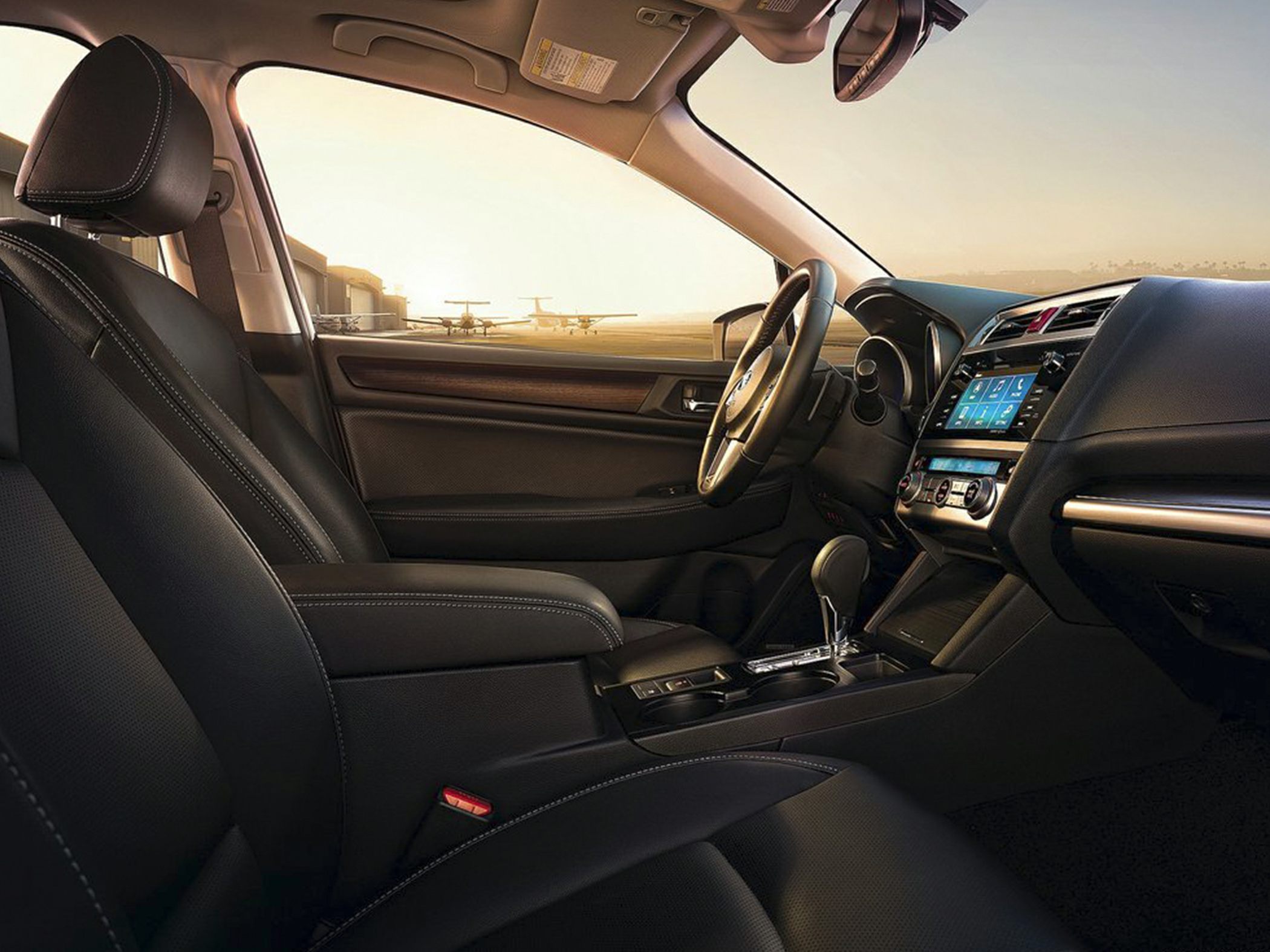 Leather seats and dashboard with touchscreen in modern car cabin