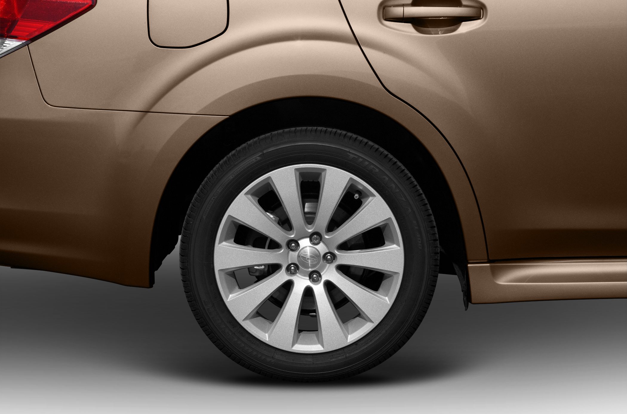 Close-up of alloy wheel and rear door handle