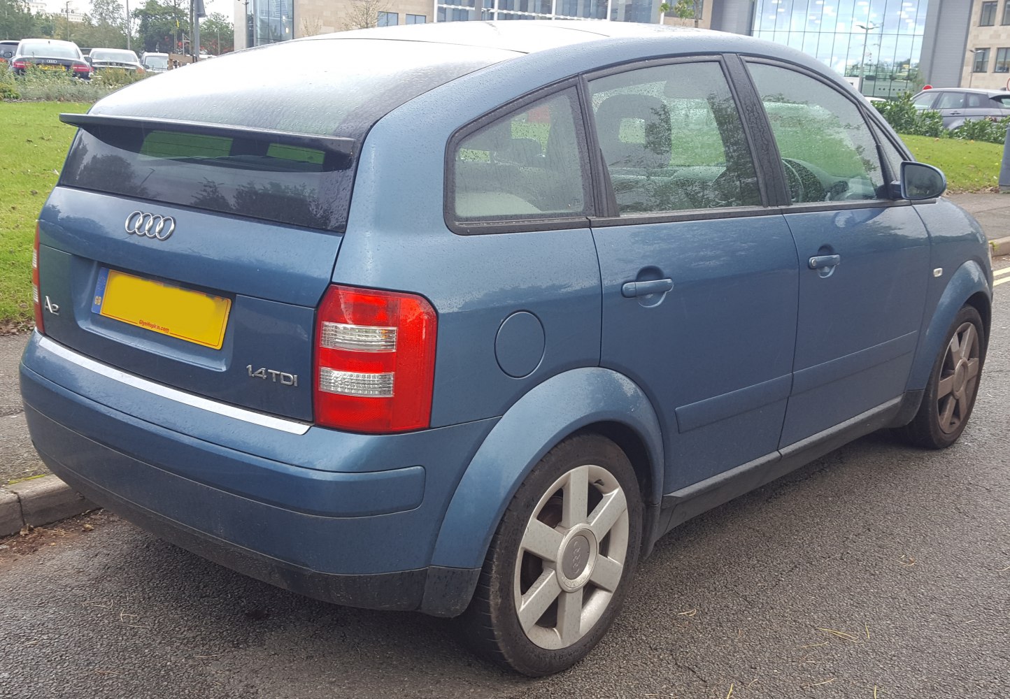 Compact hatchback rear side profile with distinct tail lights and alloy wheels