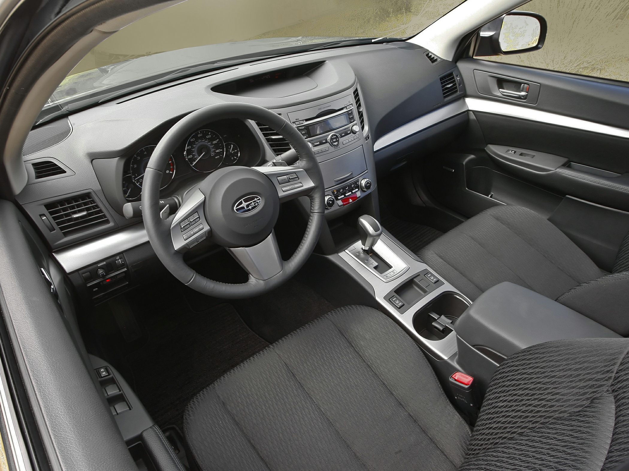 Interior of vehicle focusing on dashboard and steering wheel