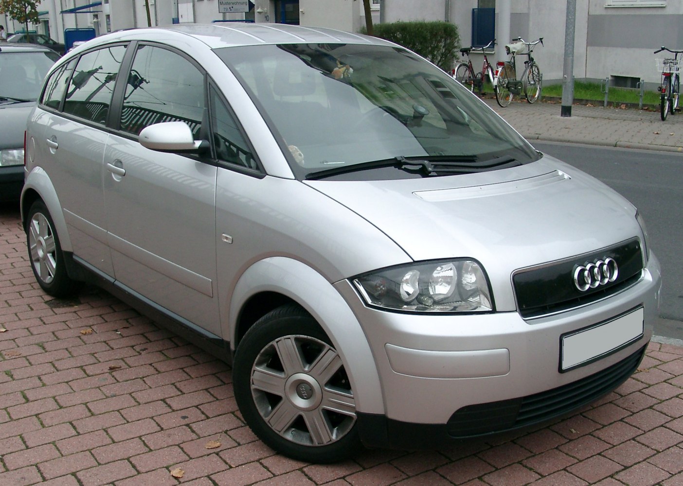 Silver compact hatchback front-left side with alloy wheels and headlights