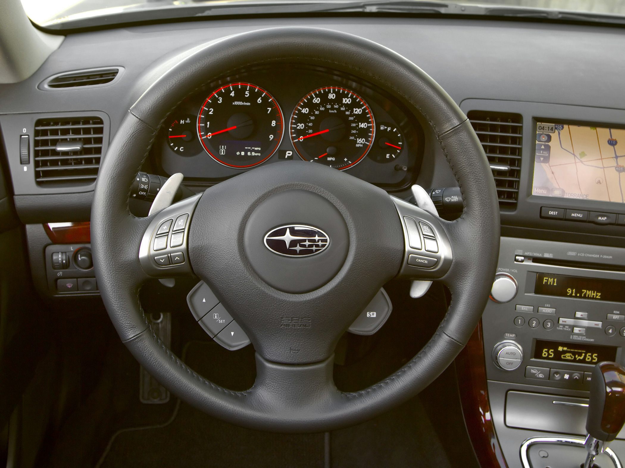 Multifunction steering wheel and dashboard with GPS and climate controls