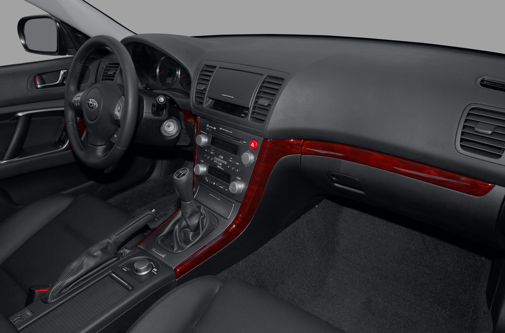 Dashboard and center console with wood trim and manual gear shift