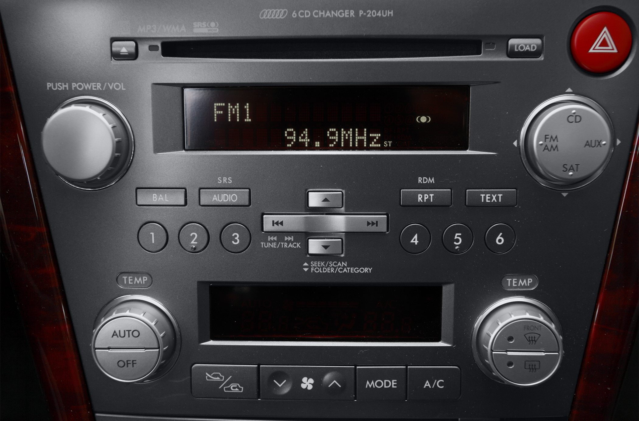 Car audio system panel with 6-CD changer and dual-zone climate controls