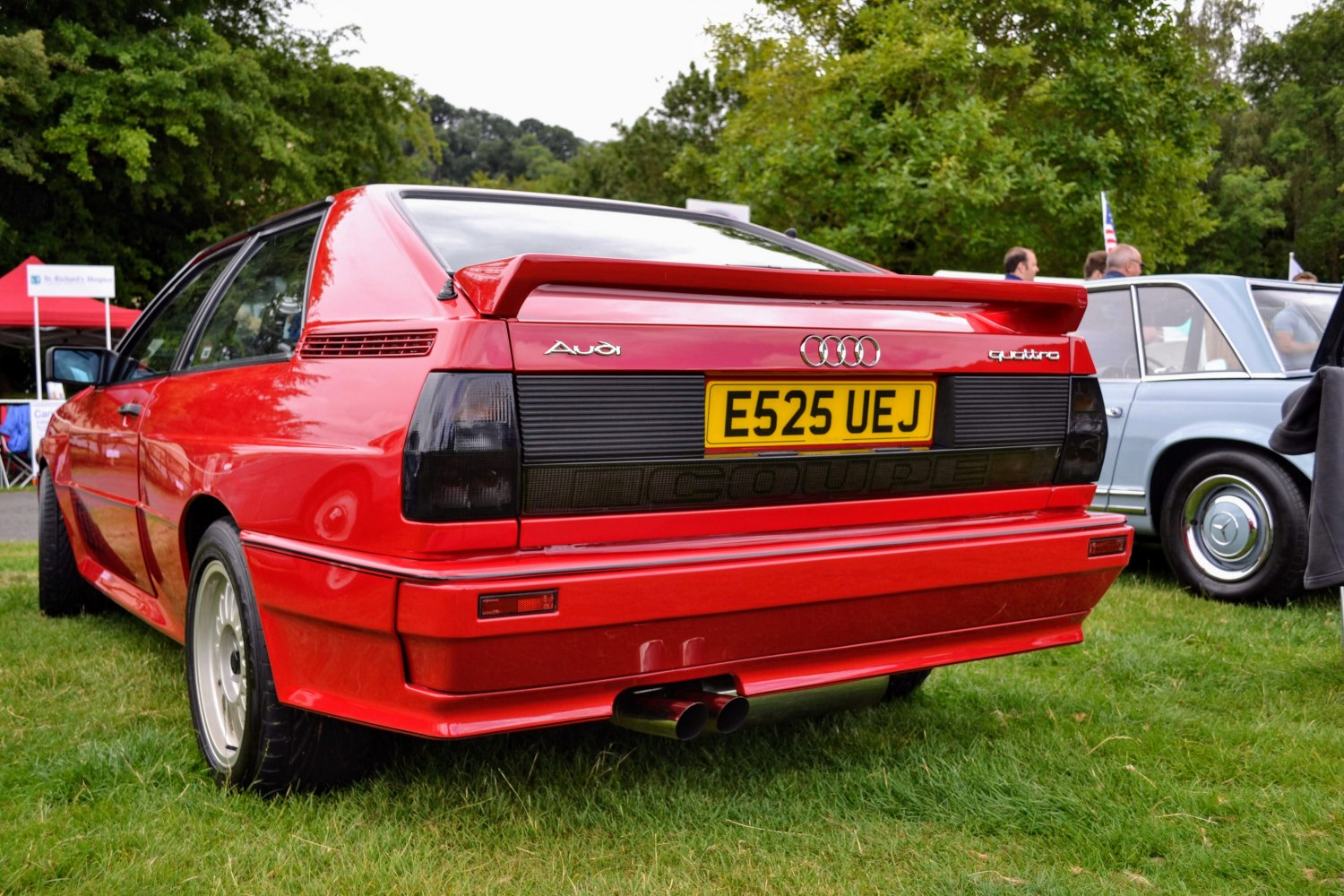 Rear view of classic sports coupe with spoiler and dual exhaust