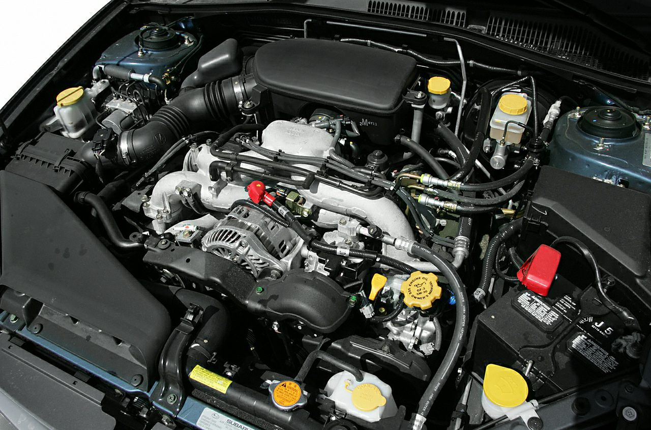 Engine bay with engine and multiple yellow fluid caps
