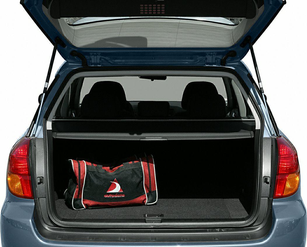 Open spacious trunk with cargo cover and duffel bag