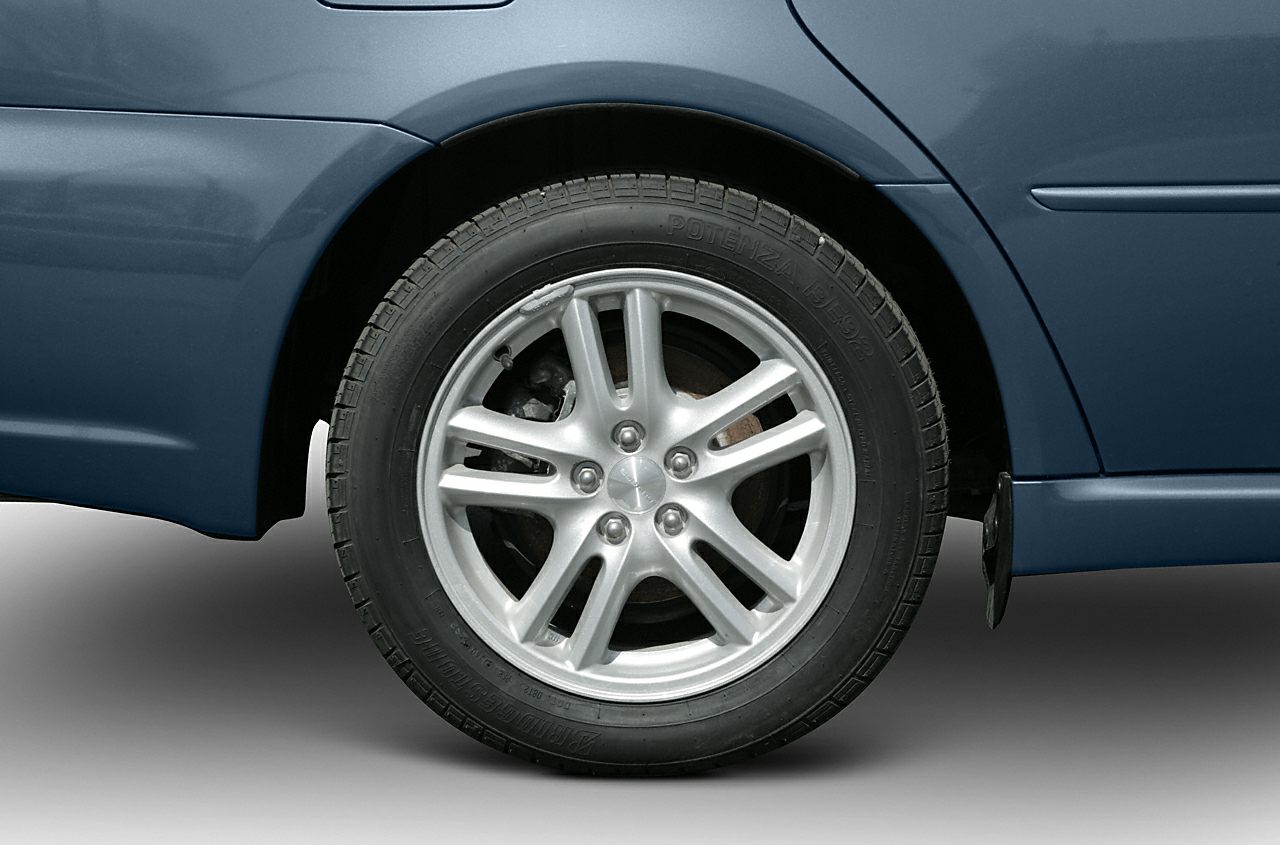 Close-up of alloy wheel and tire on a station wagon.