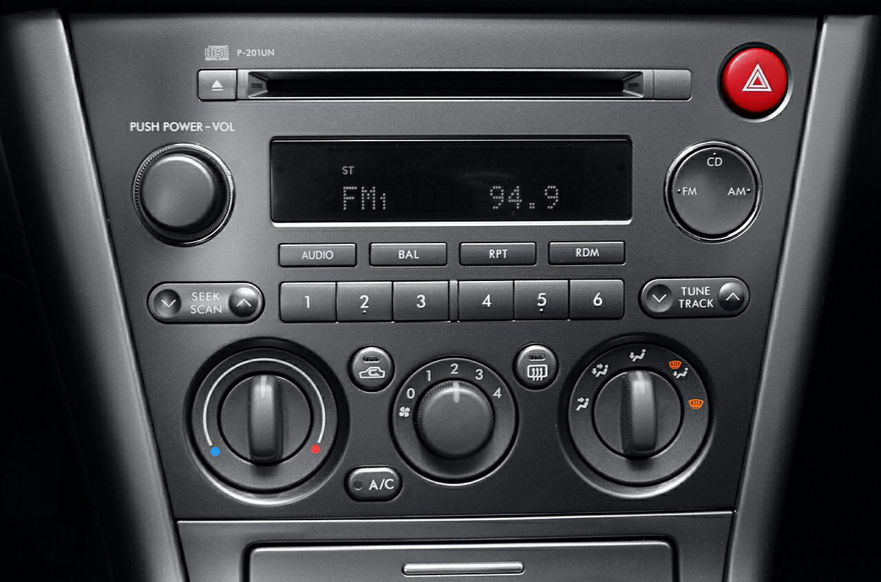 Audio system and manual climate controls with dials and buttons