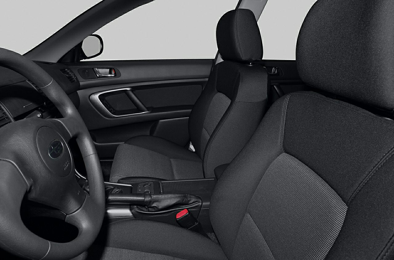 Front seats and center console with steering wheel and handbrake