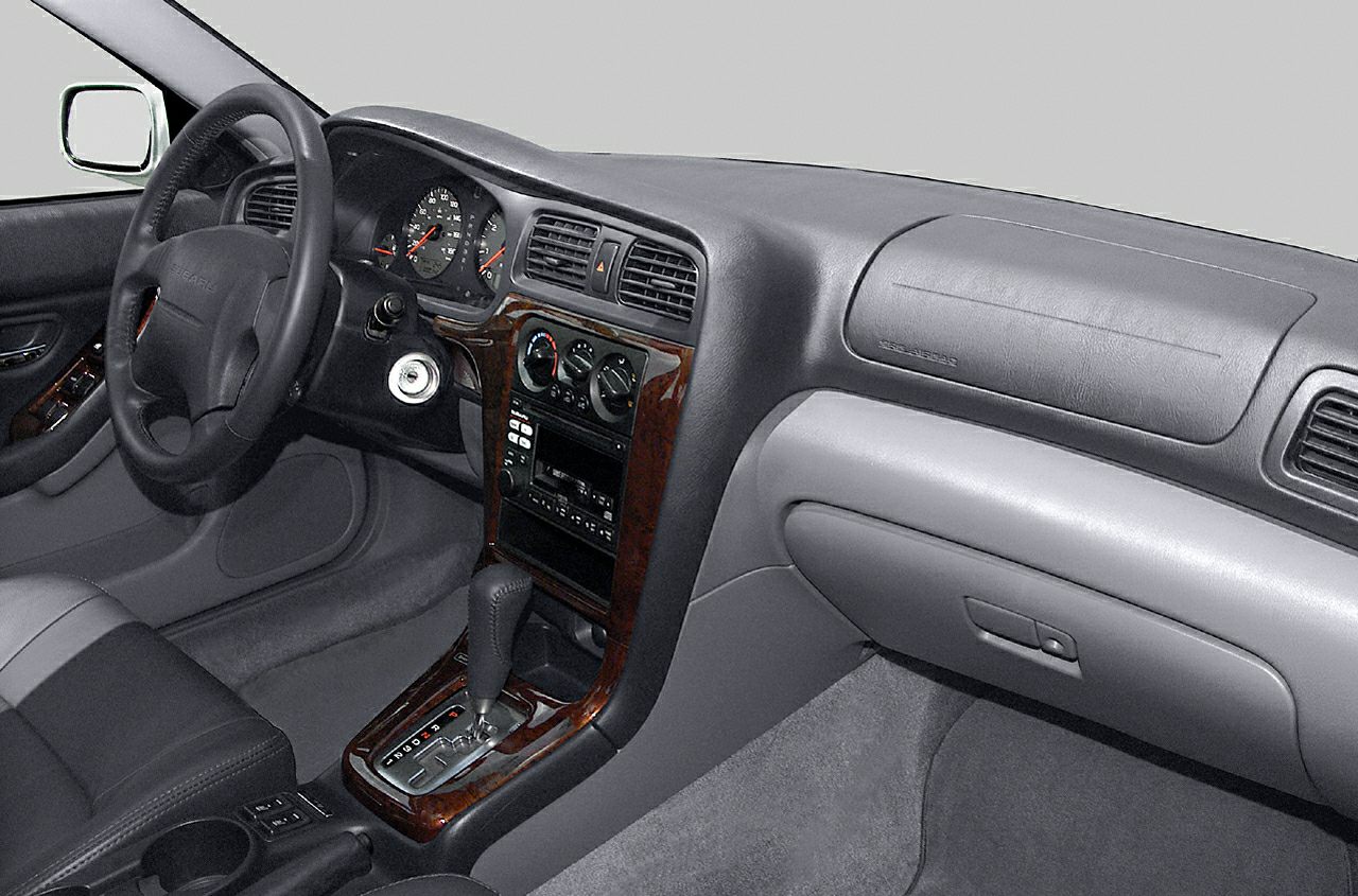 Interior dashboard and center console with wood trim and automatic gear shifter