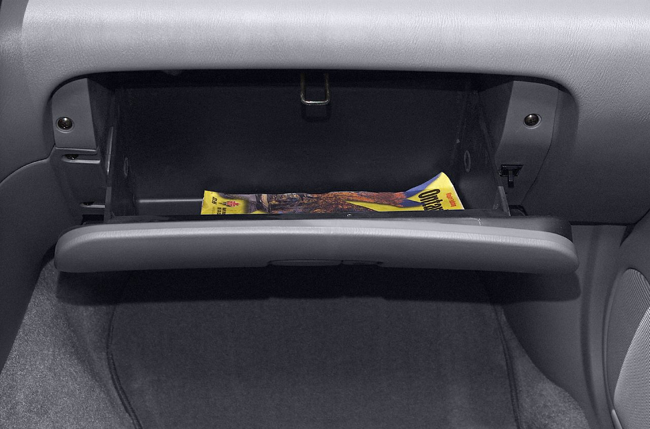 Open glovebox storage compartment in vehicle interior