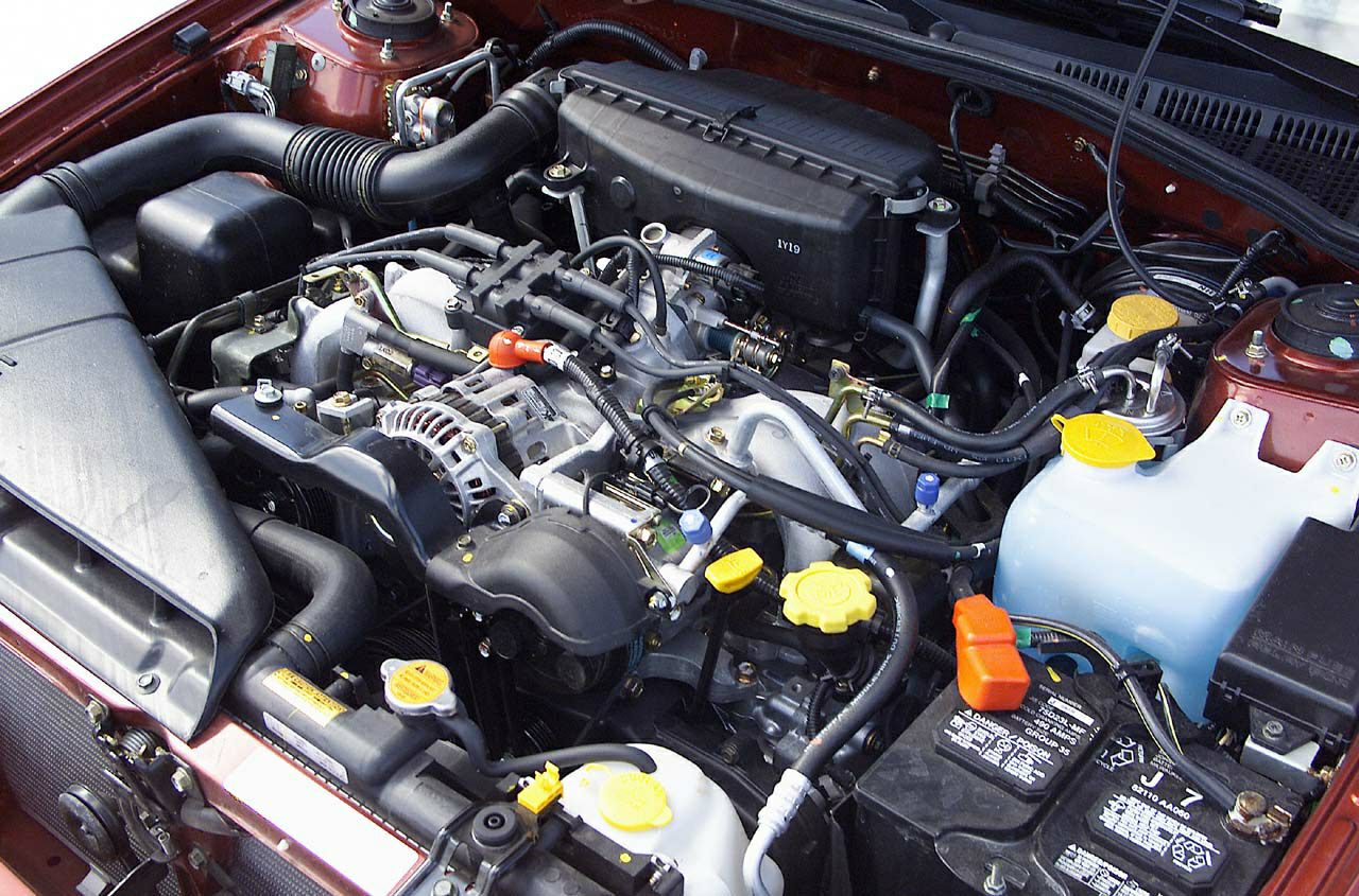 Engine bay of a car showing engine components and layout