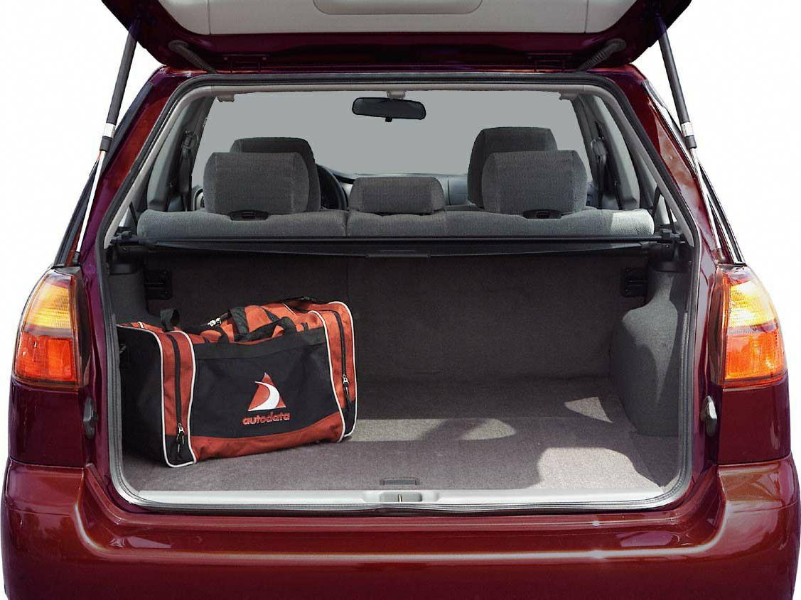 Open rear hatch cargo space with duffel bag and rear seats visible