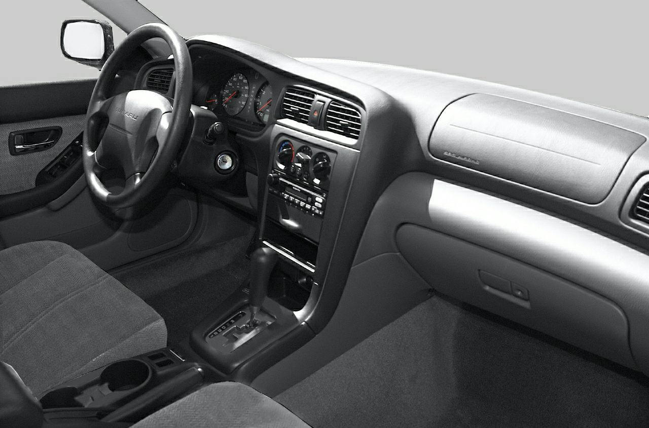 Dashboard and center console with steering wheel and fabric seats