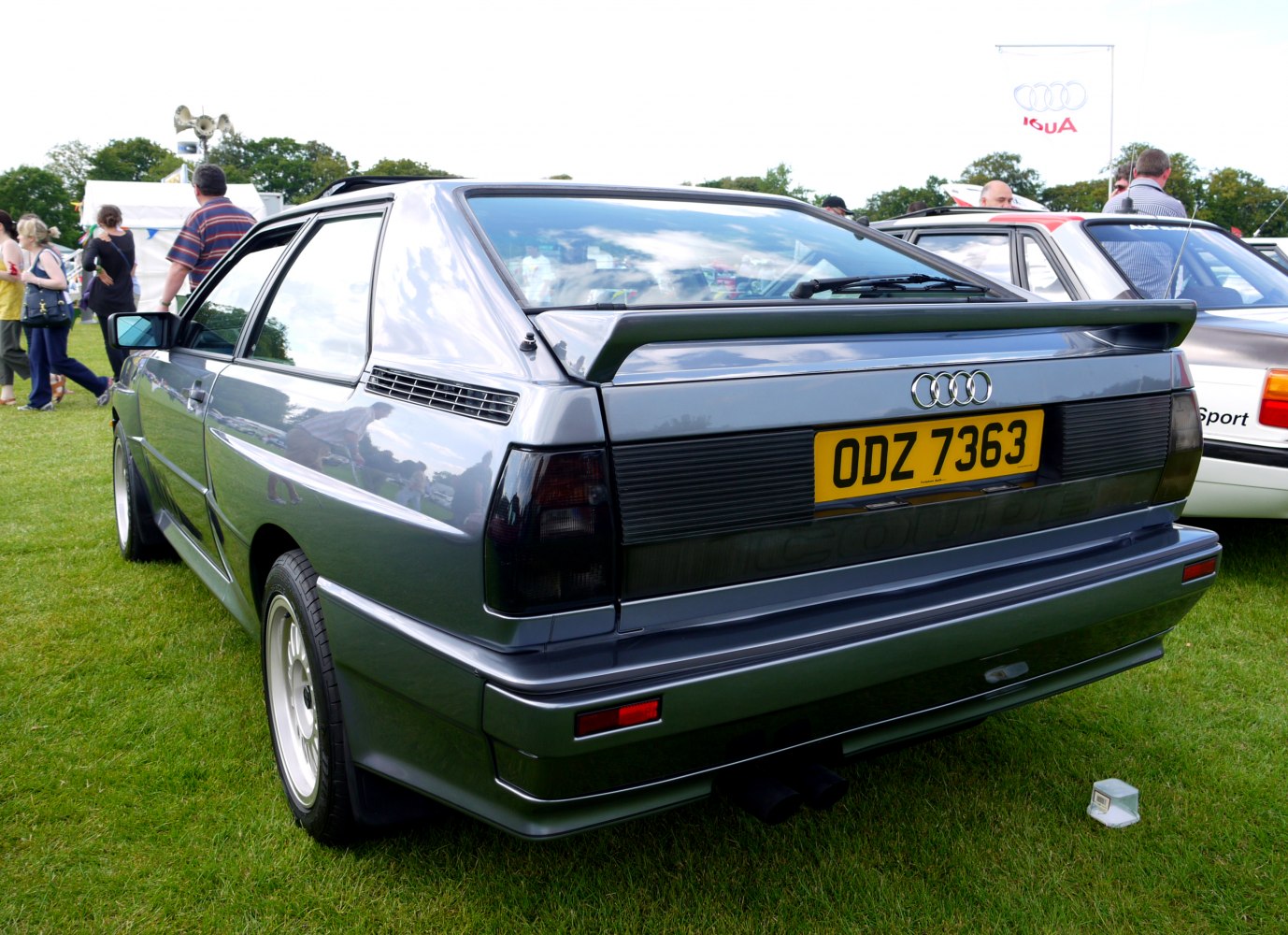 Rear view showing hatchback design and spoiler of a classic 1980s sports coupe