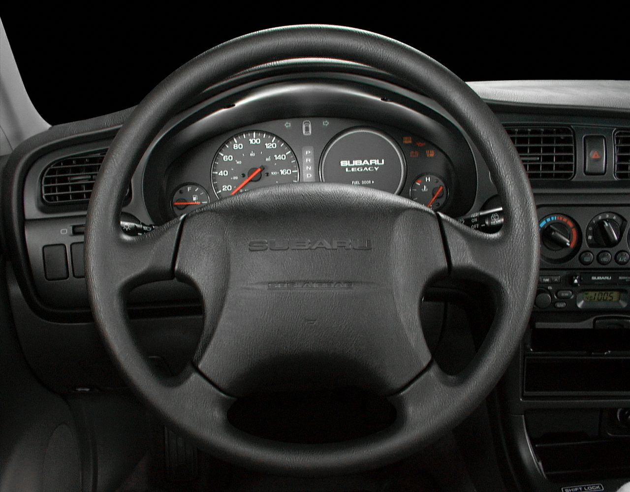 Steering wheel and dashboard with instrument cluster and control panel
