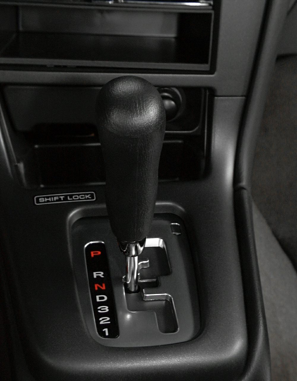 Automatic gear shift lever with gear indicator and shift lock