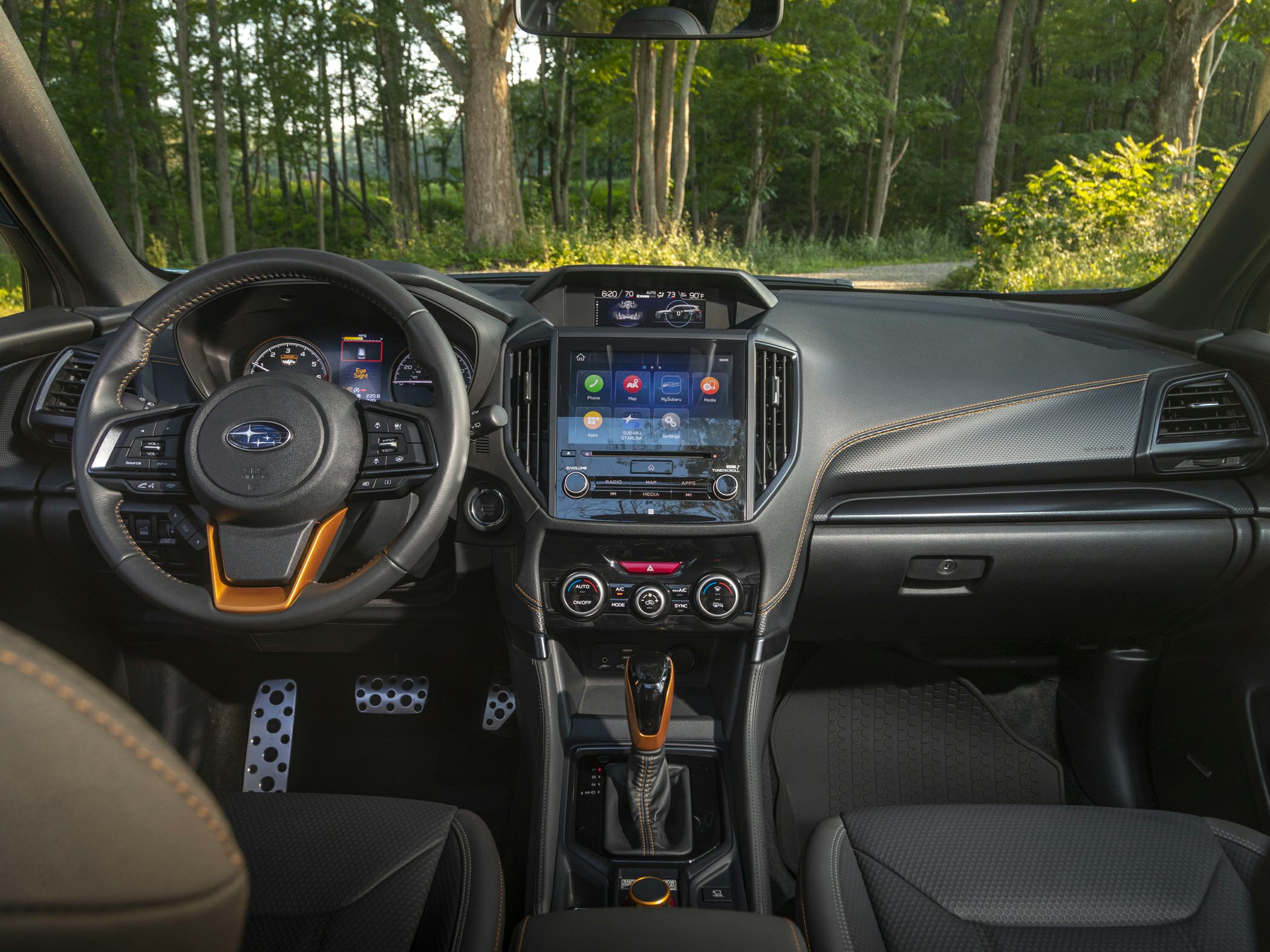 Touchscreen infotainment, sport pedals, modern dashboard, multifunction steering wheel