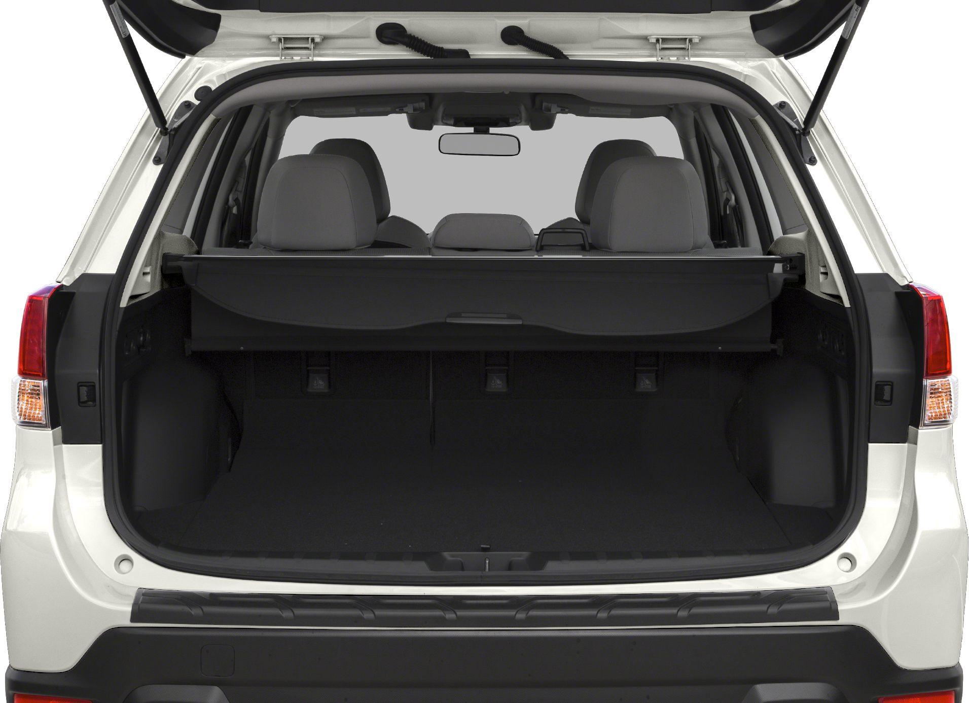 Open SUV cargo area with rear seats and retractable cover