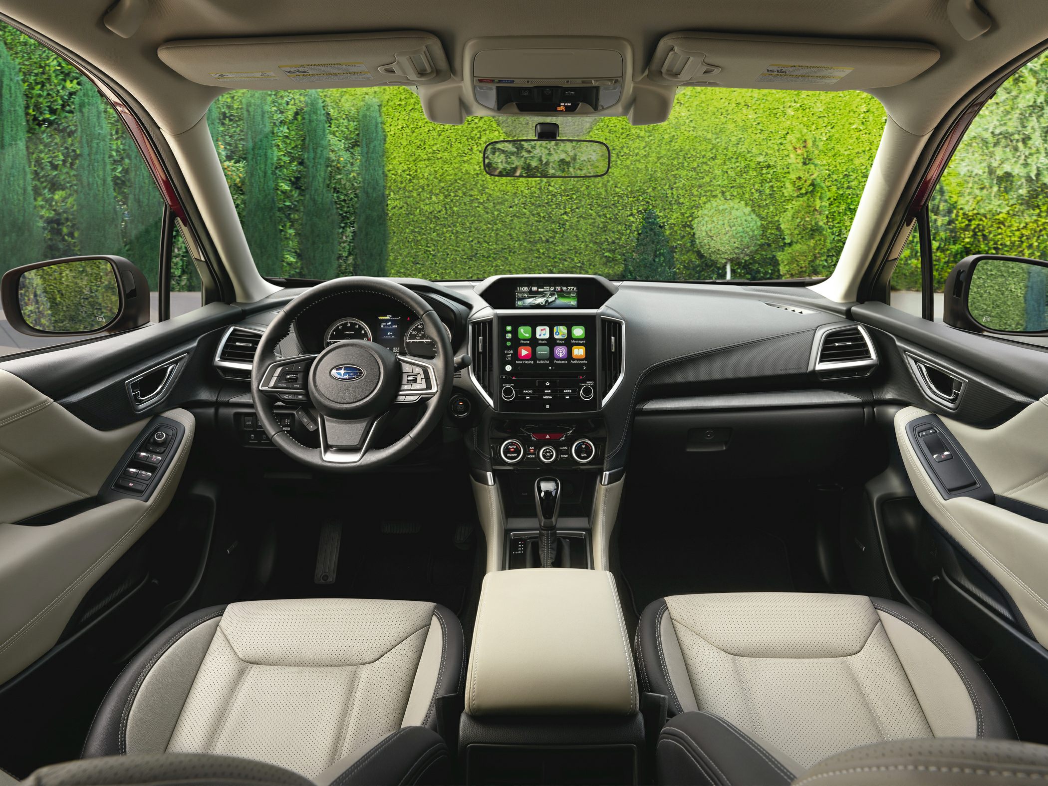Interior view with dashboard, steering wheel, and touchscreen infotainment system