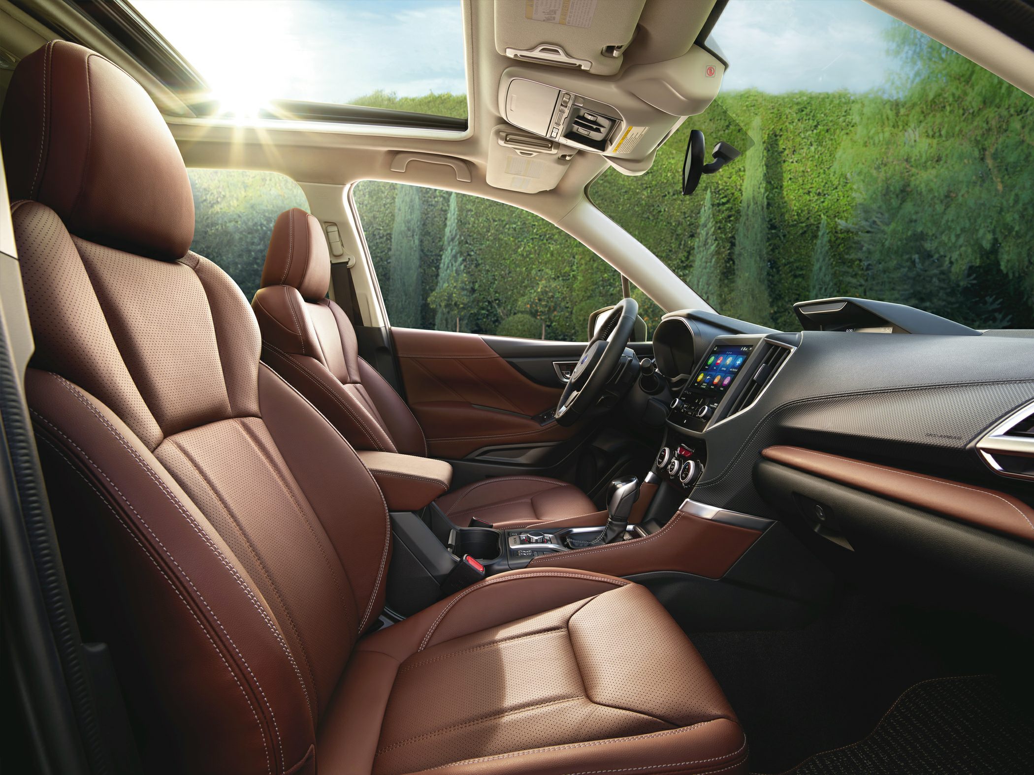 Brown leather seats and panoramic sunroof with advanced dashboard