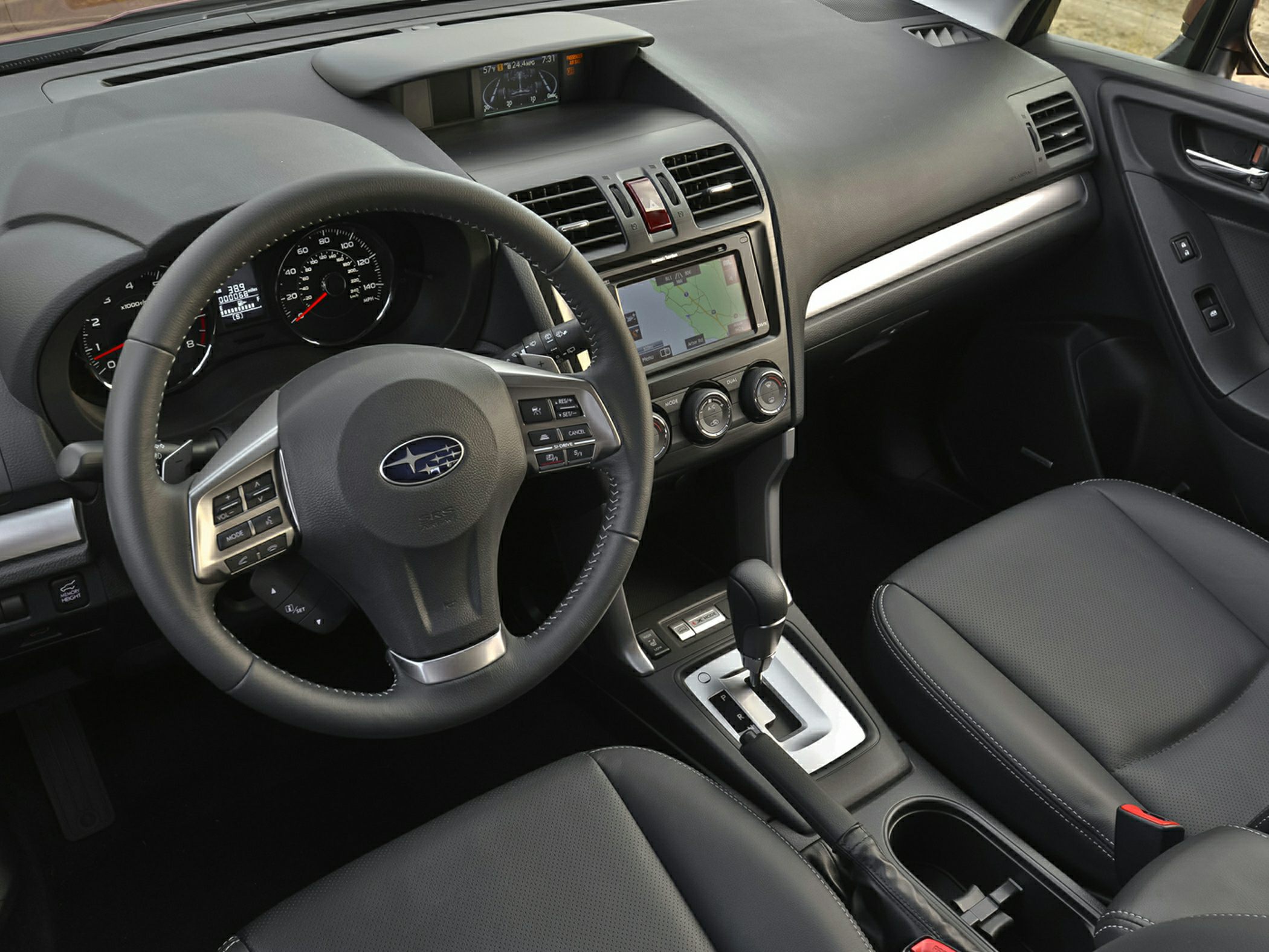 Dashboard view with steering wheel, touchscreen, and gear lever