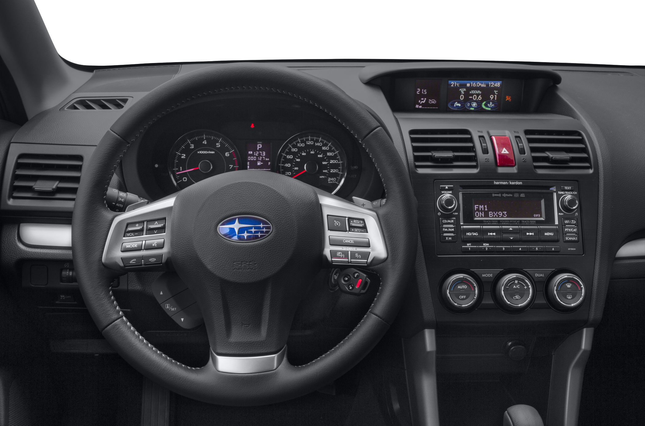 Steering wheel, dashboard gauges, center console with audio and climate controls