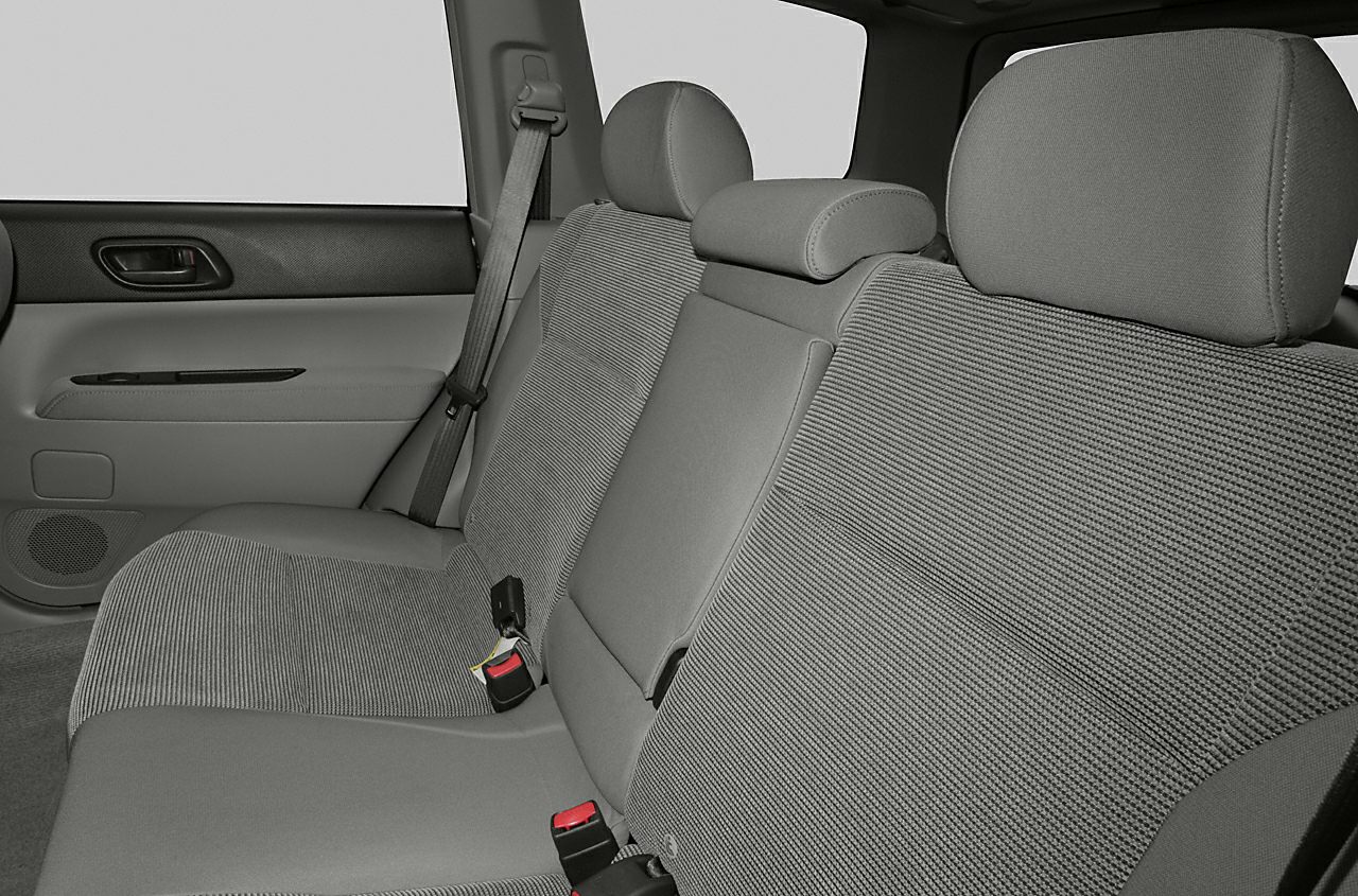 Rear seat with fabric upholstery, seat belts, and headrests