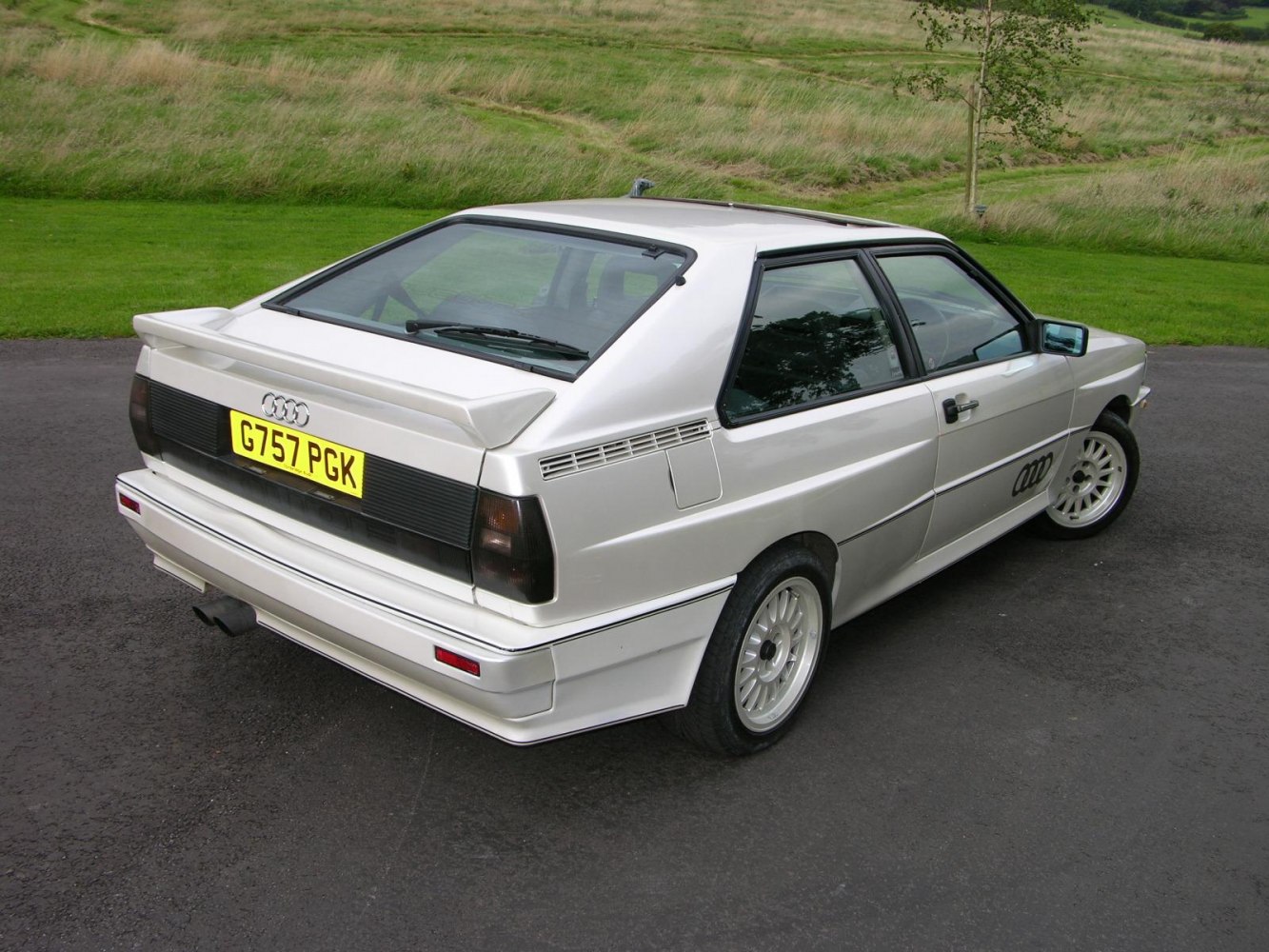 Rear view of a classic hatchback with iconic spoiler