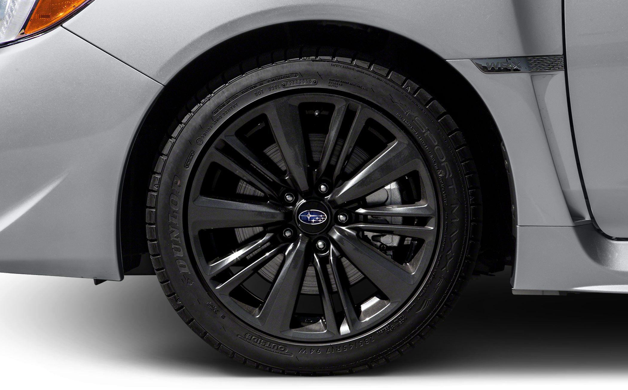 Black alloy wheel with WRX badge on side fender