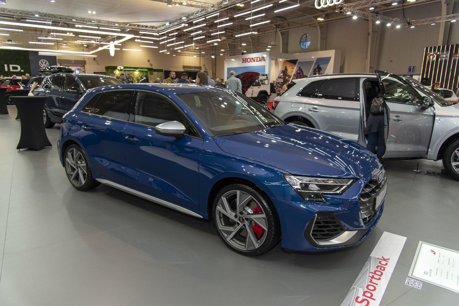 Blue hatchback with alloy wheels and red brake calipers