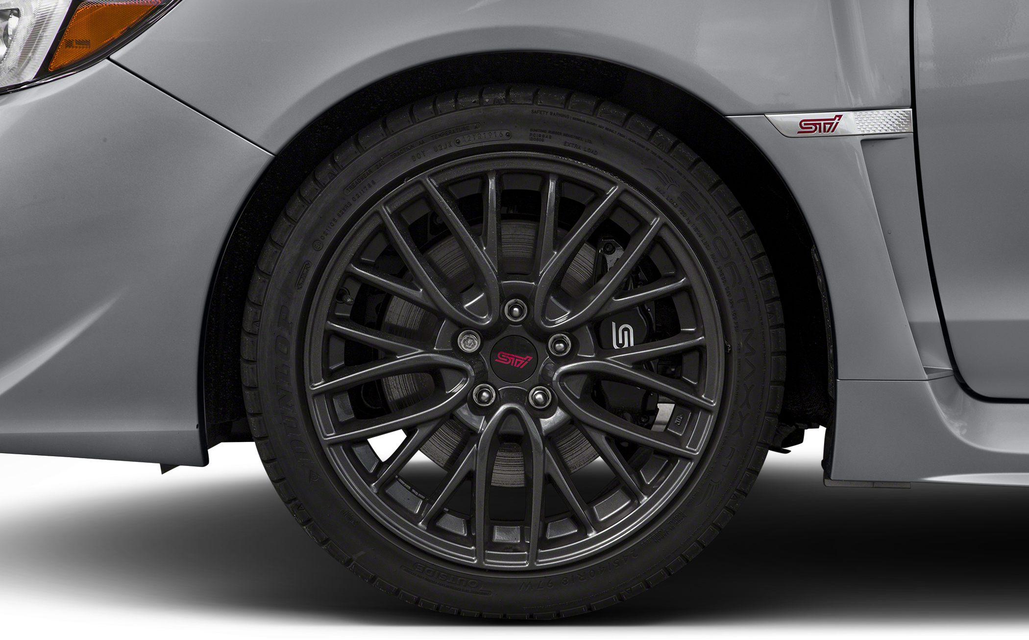 Multi-spoke alloy wheel and visible brake caliper