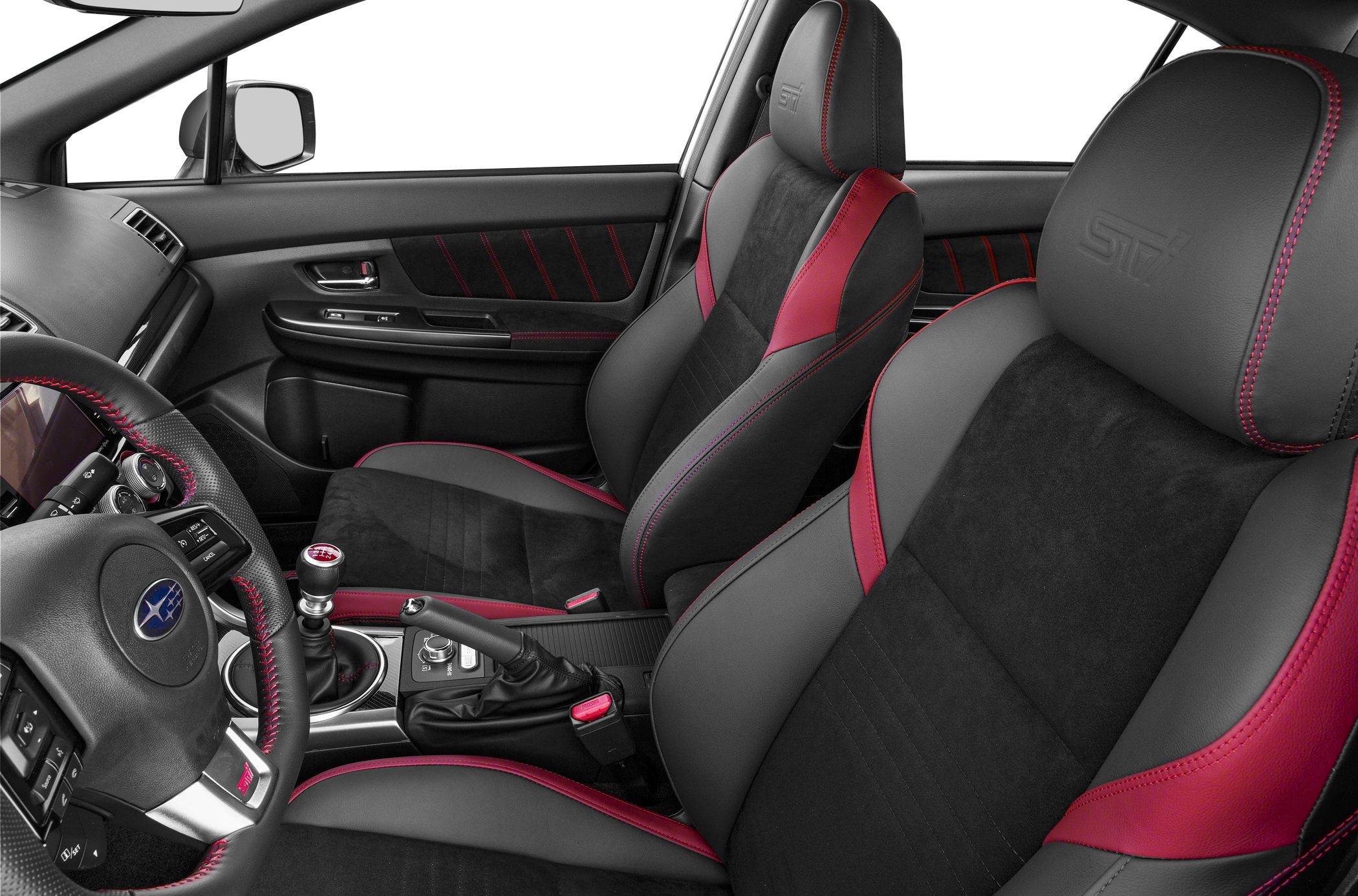 Sporty front seats with red stitching and manual gearshift lever