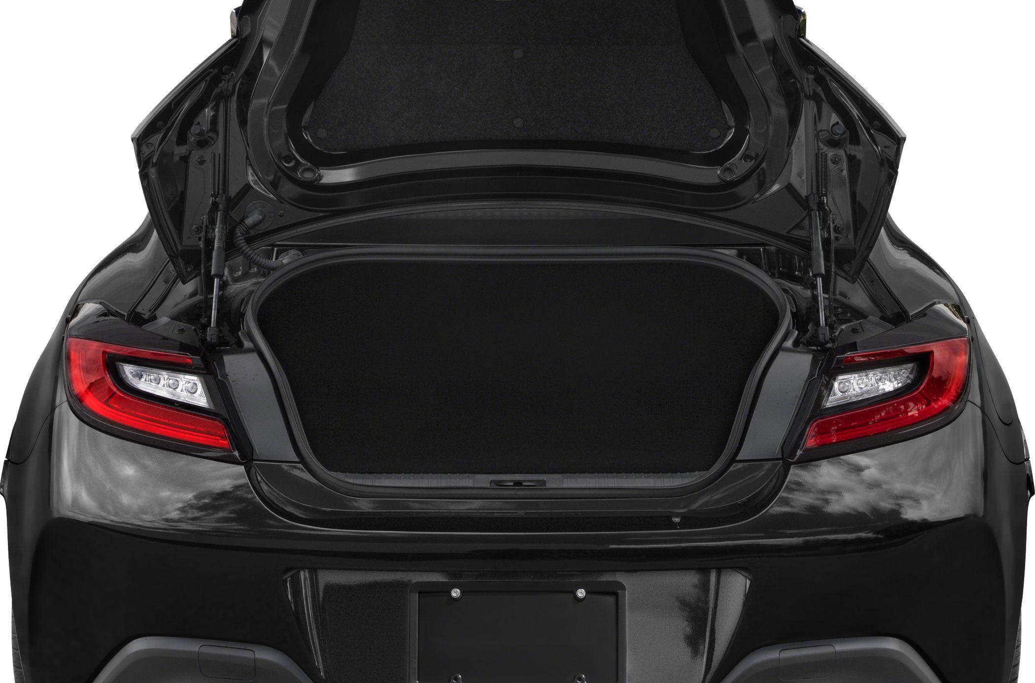 Open rear trunk with black interior and red LED tail lights.
