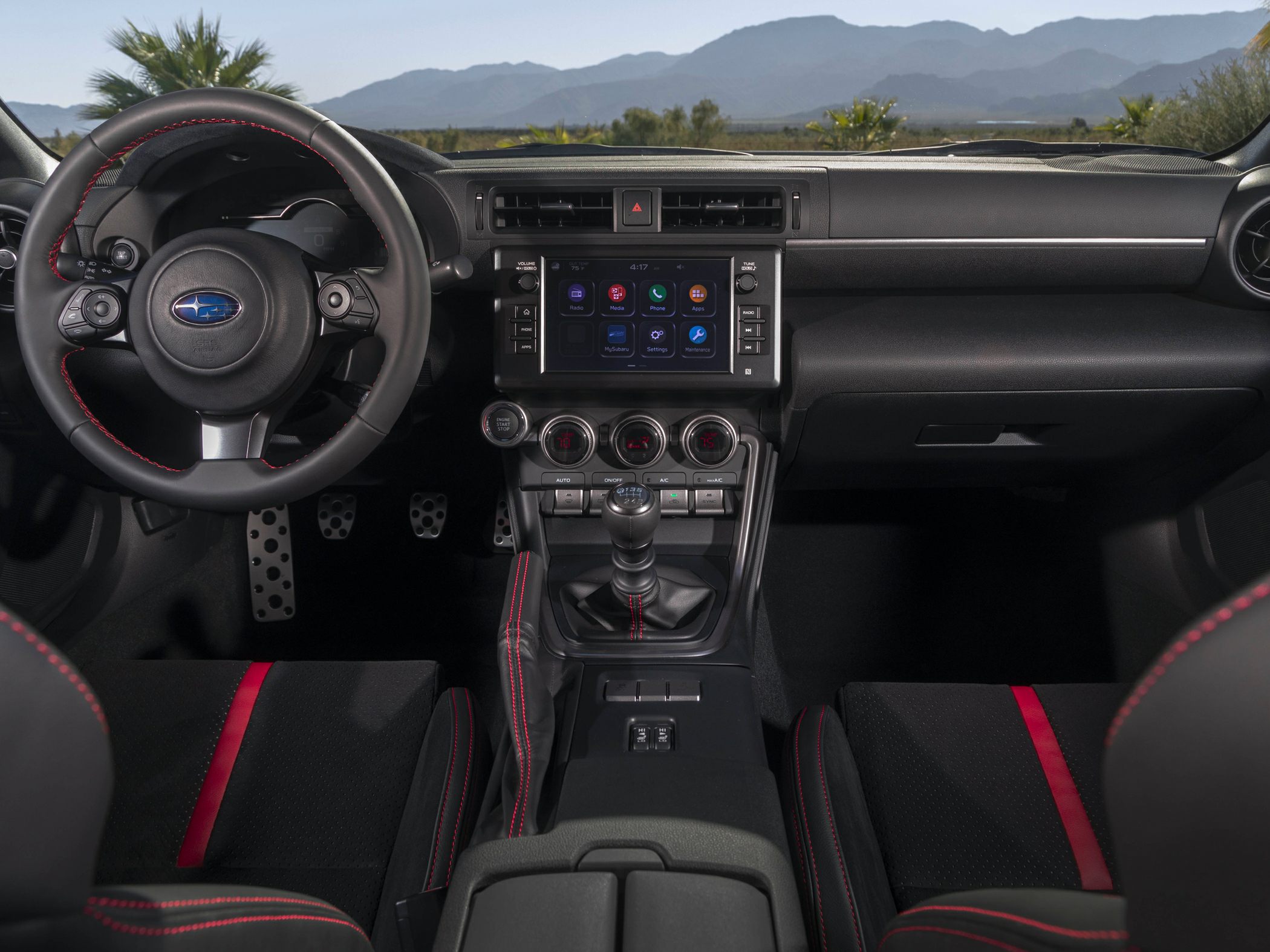 Sporty car interior with manual gearbox and infotainment screen