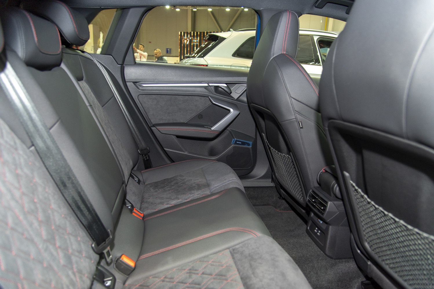 Rear seat interior with premium upholstery and red contrast stitching
