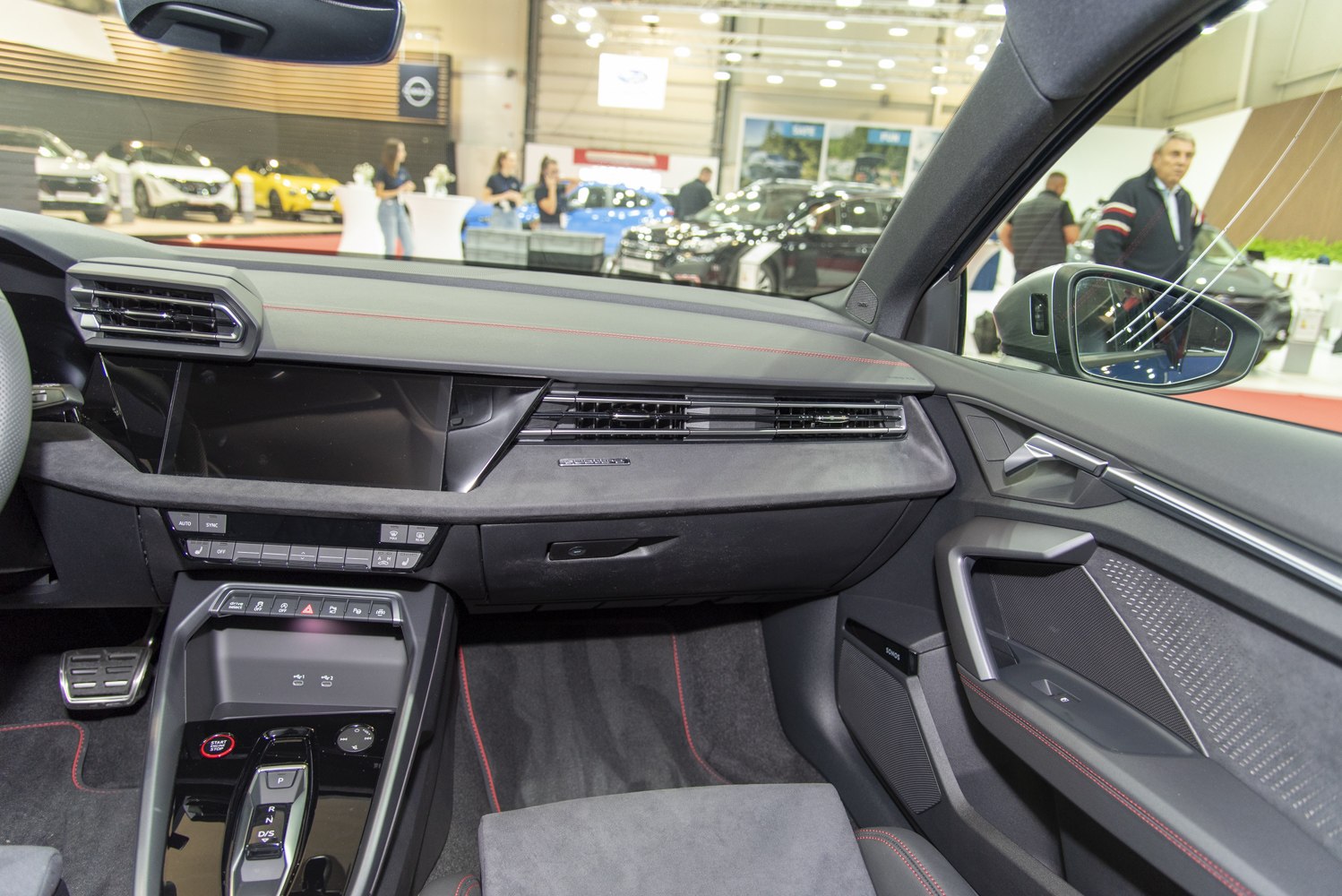 Modern car interior with dashboard, center console, and door panel details