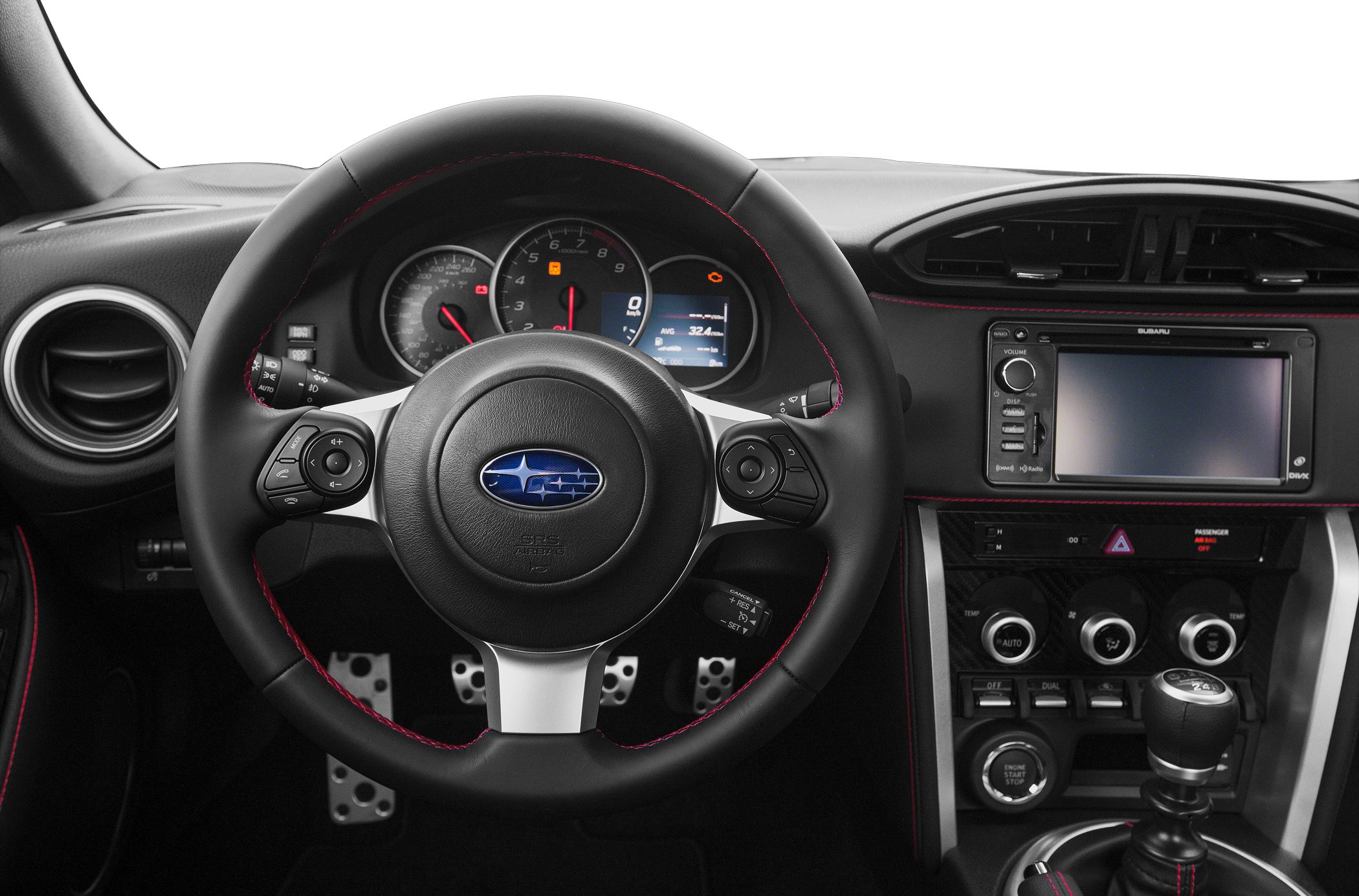 Steering wheel, instrument cluster, infotainment system, and climate controls.