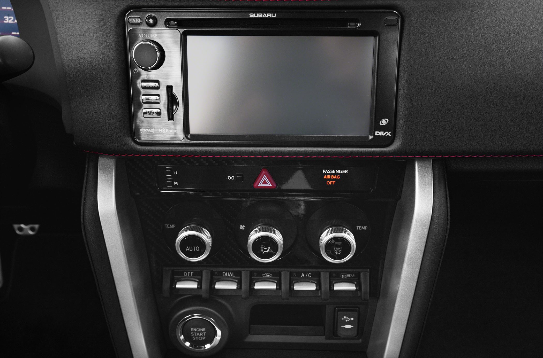 Car center console with infotainment and climate control knobs