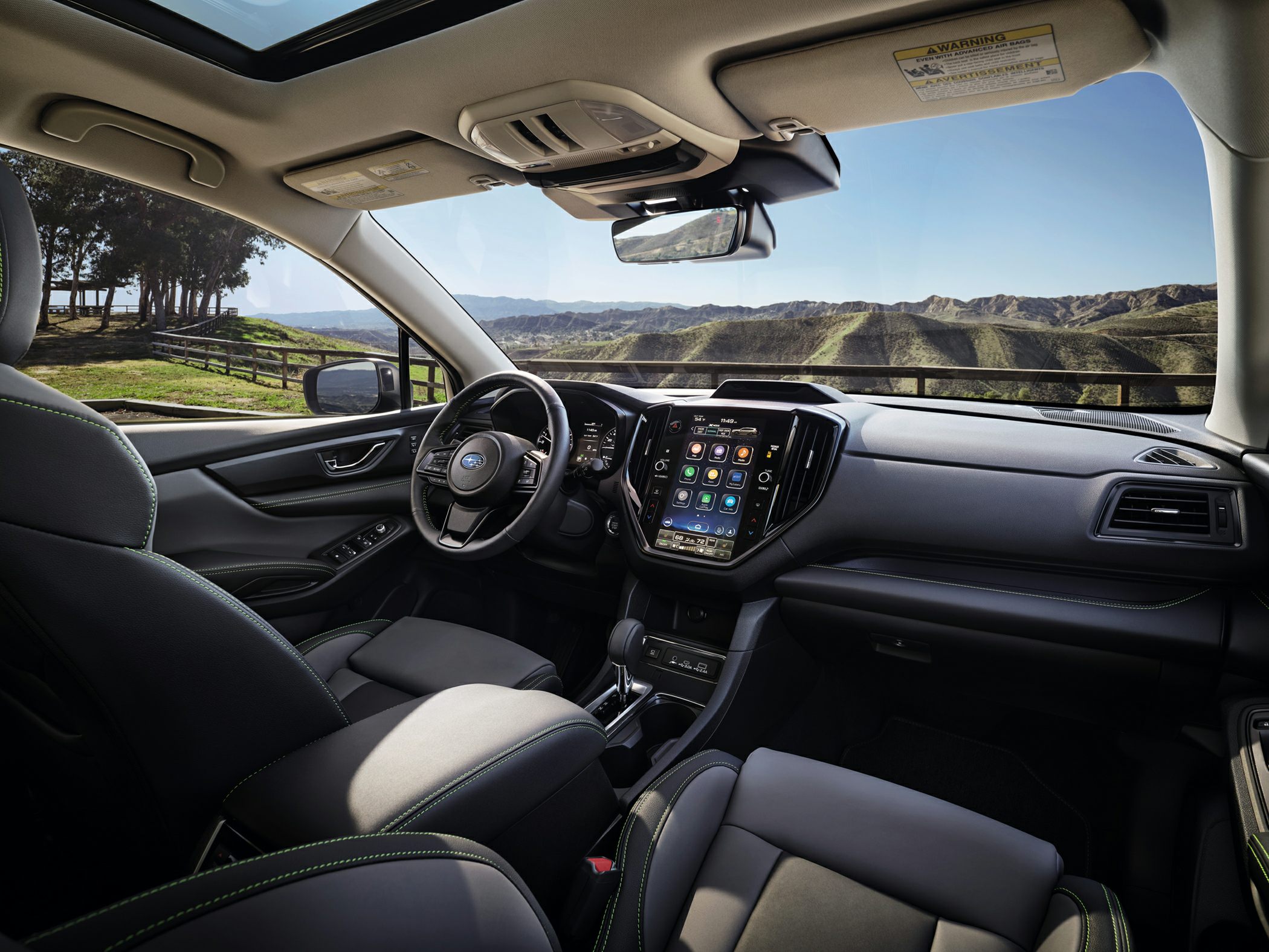 Interior with large touchscreen and panoramic sunroof